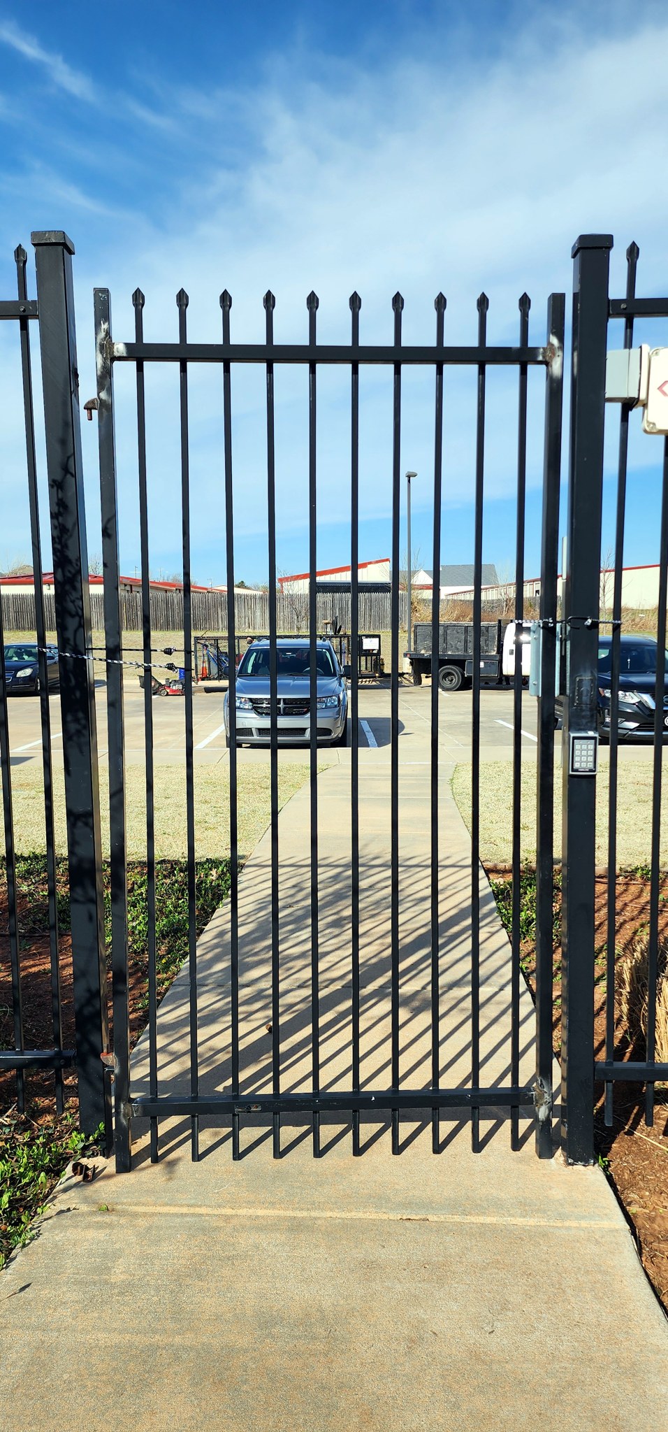 Metal gate with keypad lock