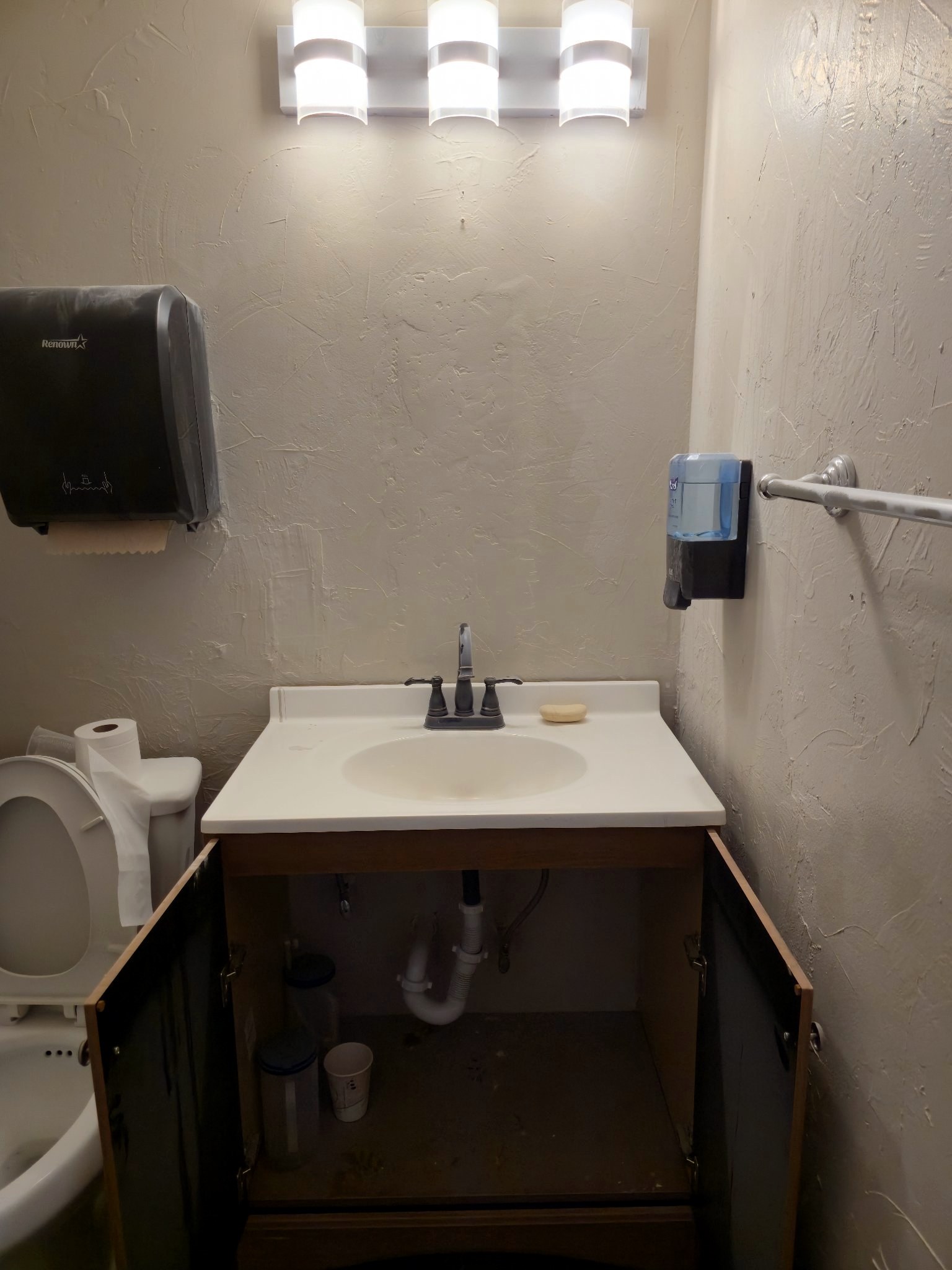 Finished restroom vanity after leak repair